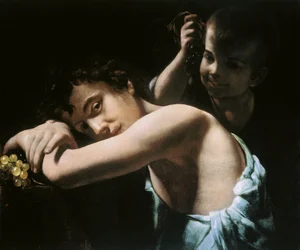 Twee jongeren met druiven